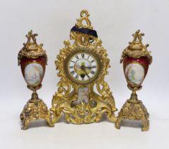 An early 20th century French gilt metal clock garniture, 30cm