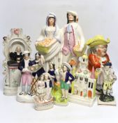 Seven 19th century Staffordshire figure groups including Orange Sellers and Wesley, together with