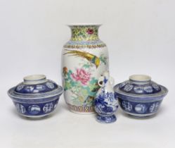A Chinese famille rose vase, two Japanese blue and white rice bowls and covers and a Japanese blue