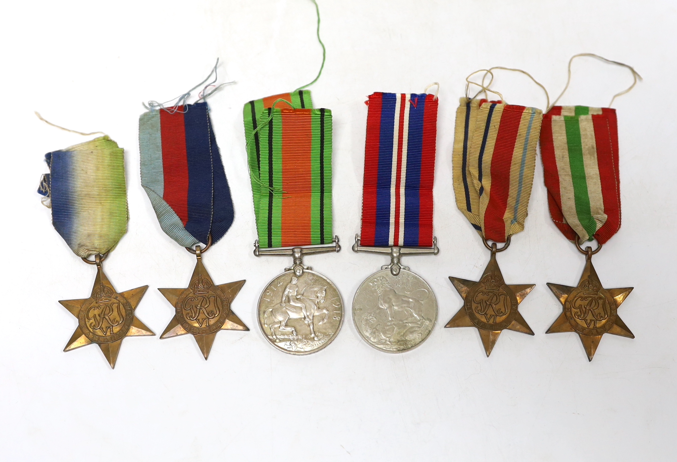 Six WWII medals. The Atlantic Star, The Italy Star, The Africa Star, The 1939-45 Star, The Defence