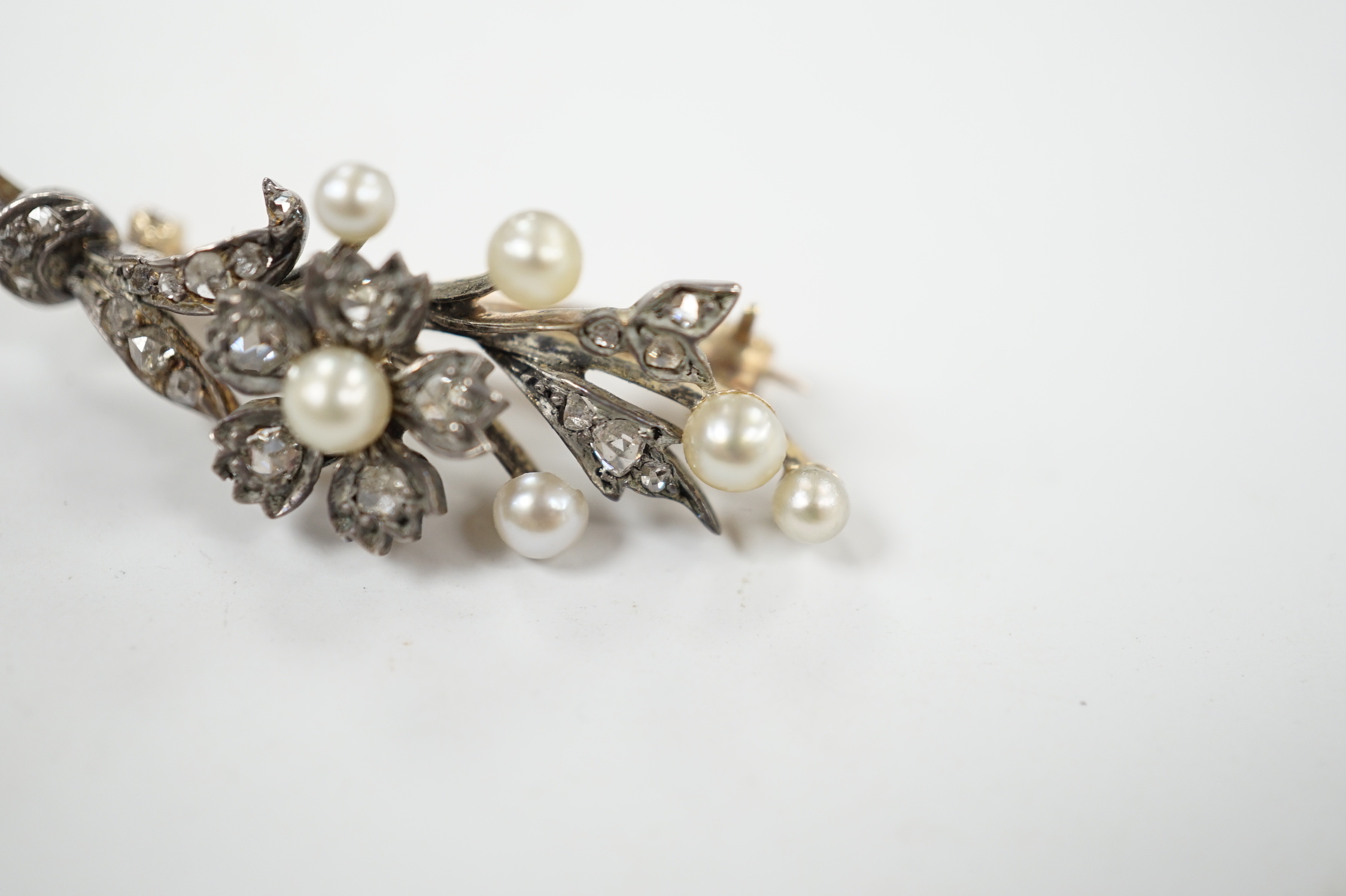 A cased Victorian yellow metal, seed pearl and rose cut diamond set foliate spray brooch, 39mm, - Image 4 of 7
