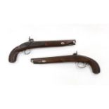 A pair of 12 bore percussion pistols converted from percussion sporting guns, round twist barrels,