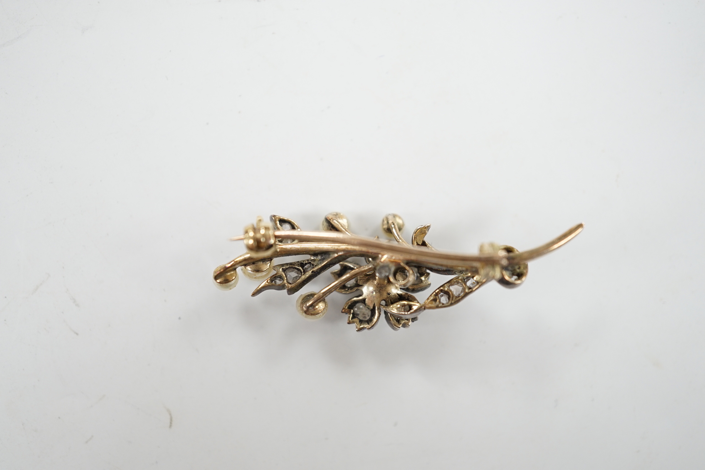 A cased Victorian yellow metal, seed pearl and rose cut diamond set foliate spray brooch, 39mm, - Image 5 of 7