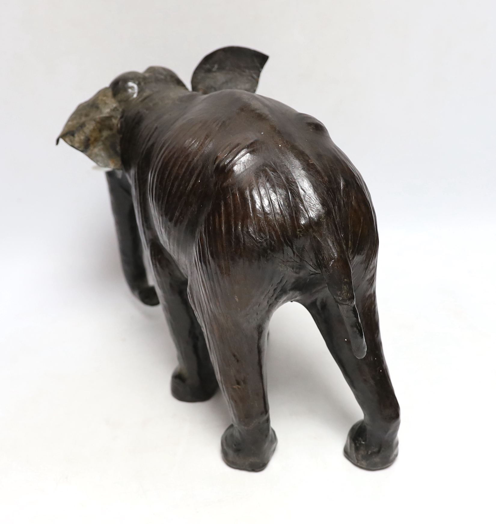 A leather elephant, stamped Liberty to the underside, 30cm wide - Image 3 of 4