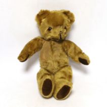 A mid 20th century teddy bear, probably Merrythought, 37cm high