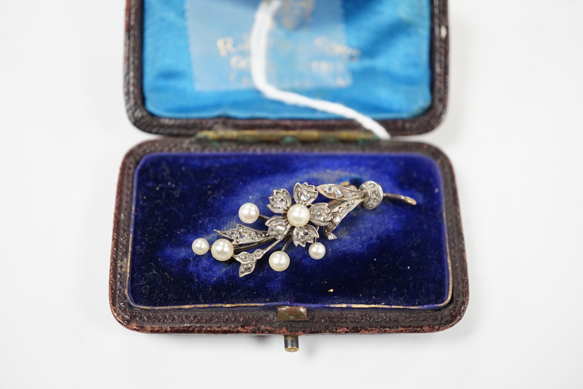 A cased Victorian yellow metal, seed pearl and rose cut diamond set foliate spray brooch, 39mm, - Image 7 of 7