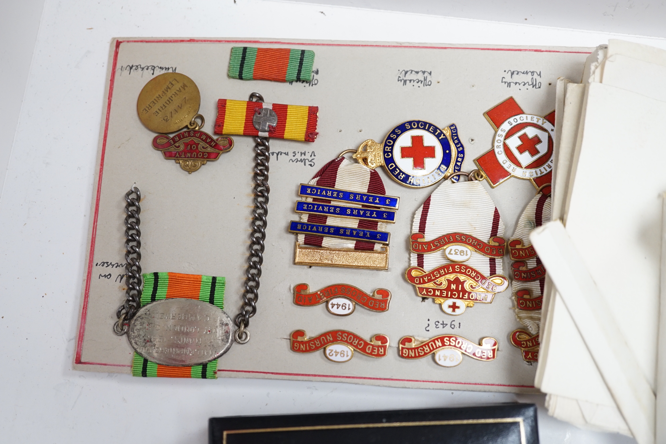 A collection of British Red Cross, medals, badges and memorabilia including a brass plaque, - Image 4 of 4