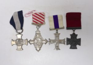 Four well produced replica medals. A Victoria Cross, a Distinguished Service Cross, a Military Cross