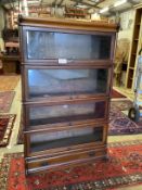 A Globe Wernicke style mahogany four section bookcase, width 87cm, depth 26cm, height 141cm