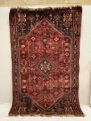 A North West Persian red ground carpet, 264 x 165cm