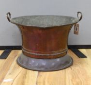 An early 20th century copper jardiniere, 43cm handle to handle