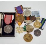 Thirty world military and commemorative medals including; a Belgium War Aid Medal 1914-18, Nigeria