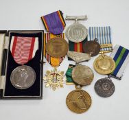 Thirty world military and commemorative medals including; a Belgium War Aid Medal 1914-18, Nigeria