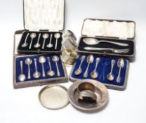 Four various silver serviette rings and a plated napkin ring, two small silver dishes, three various