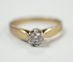 A yellow metal and solitaire diamond set ring, size N/O, gross weight 2.4 grams.