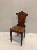 An early Victorian carved oak hall chair, of Scottish origin, width 40cm, depth 37cm, height 86cm