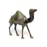 An Eastern bronze figure of a camel, 22cm wide