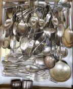 Three silver napkin rings, three silver spoons and a quantity of silver plated cutlery.