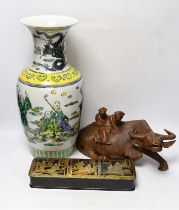 A Chinese famille verte vase, a papier-mâché box and a Chinese hardwood carving of an ox, tallest