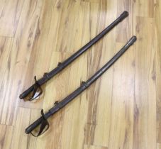 * * A pair of late 19th century German swords and scabbards, made for the international arms