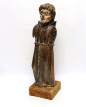 An oak carved monk with polychrome face, 54cm high