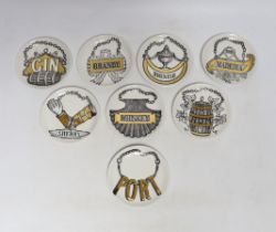 A set of eight Fornasetti ‘Vini e Liquori’ coasters, 1960's, 10cm in diameter