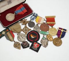 A collection of medals and badges, including eight Special Constabulary Service Medals, Fire Service
