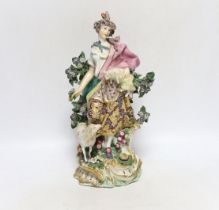 An 18th century Chelsea /Derby figure, of a girl holding a lamb, gold anchor mark, 30cm high