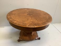An Austrian marquetry inlaid circular walnut dining table, diameter 114cm, height 79cm, together