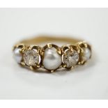 A late Victorian yellow metal and graduated three stone split pearl and two stone diamond set half