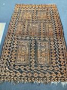 An Afghan geometric rug, 205cm x 138cm
