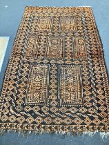 An Afghan geometric rug, 205cm x 138cm