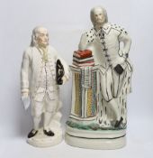 A Staffordshire pottery figure of Benjamin Franklin, modelled holding the Bill of Rights and a
