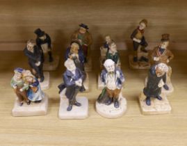 A collection of twelve Bretby cold painted pottery Dickens character figures, tallest Mr. Micawbee