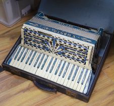 A Frontalini accordion, cased
