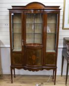 An Edwardian inlaid mahogany concave and bow front display cabinet, width 115cm, depth 36cm,
