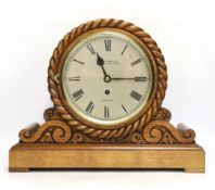 An Edwardian laminated oak single fusee mantel timepiece, A&H Rowley, 35cm high