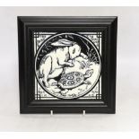 A framed Arts and Crafts Aesops Fable Minton monochrome tile “The Hare and the Tortoise run a race”,