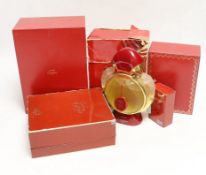 Four bottles of Cartier ‘Panthere’ perfume (three boxed boxed) plus a small bottle of Cartier eat de