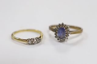 An 18ct, plat and three stone diamond chip set ring, size M and a modern 9ct gold, sapphire and