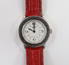 A lady's silver Must de Cartier quartz wrist watch, ref.1806, on a red leather strap, no box or