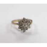 A modern 9ct gold and diamond cluster set flower head ring, size P/Q, gross weight 2.9 grams.
