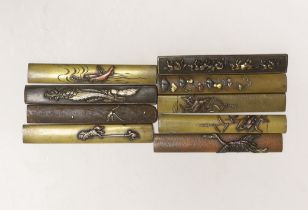 Nine Japanese mixed metal Kozuka knife handles, 19th century, each 9.5cm length