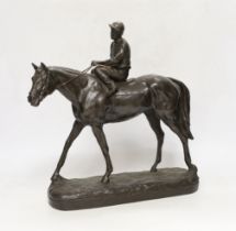 A bronzed resin racehorse and jockey figure group, 33cm high