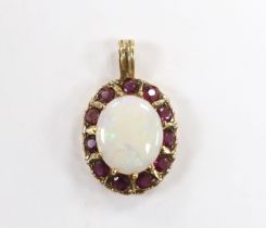 A modern 9ct gold, white opal and ruby set oval cluster pendant, overall 28mm, gross weight 3.6