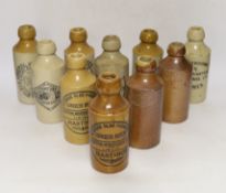 Early 20th century stoneware ginger beer bottles, four from Lewes, three from Hastings, two from Rye