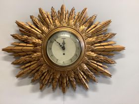 A Smiths sunburst wall timepiece, (later movement) width 68cm, height 48cm