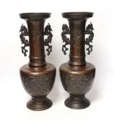 A pair of Japanese bronze vases, 38cm high