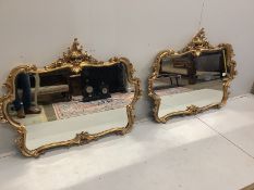 A pair of Victorian style gilt framed wall mirrors, shaped oval form, width 131cm, height 103cm