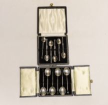Two cased sets of six Elizabeth II silver coffee spoons, including bean end and Celtic style.